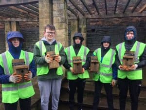Picture of Finn, Cam, Owen, Shea and Alex holding bird boxes
